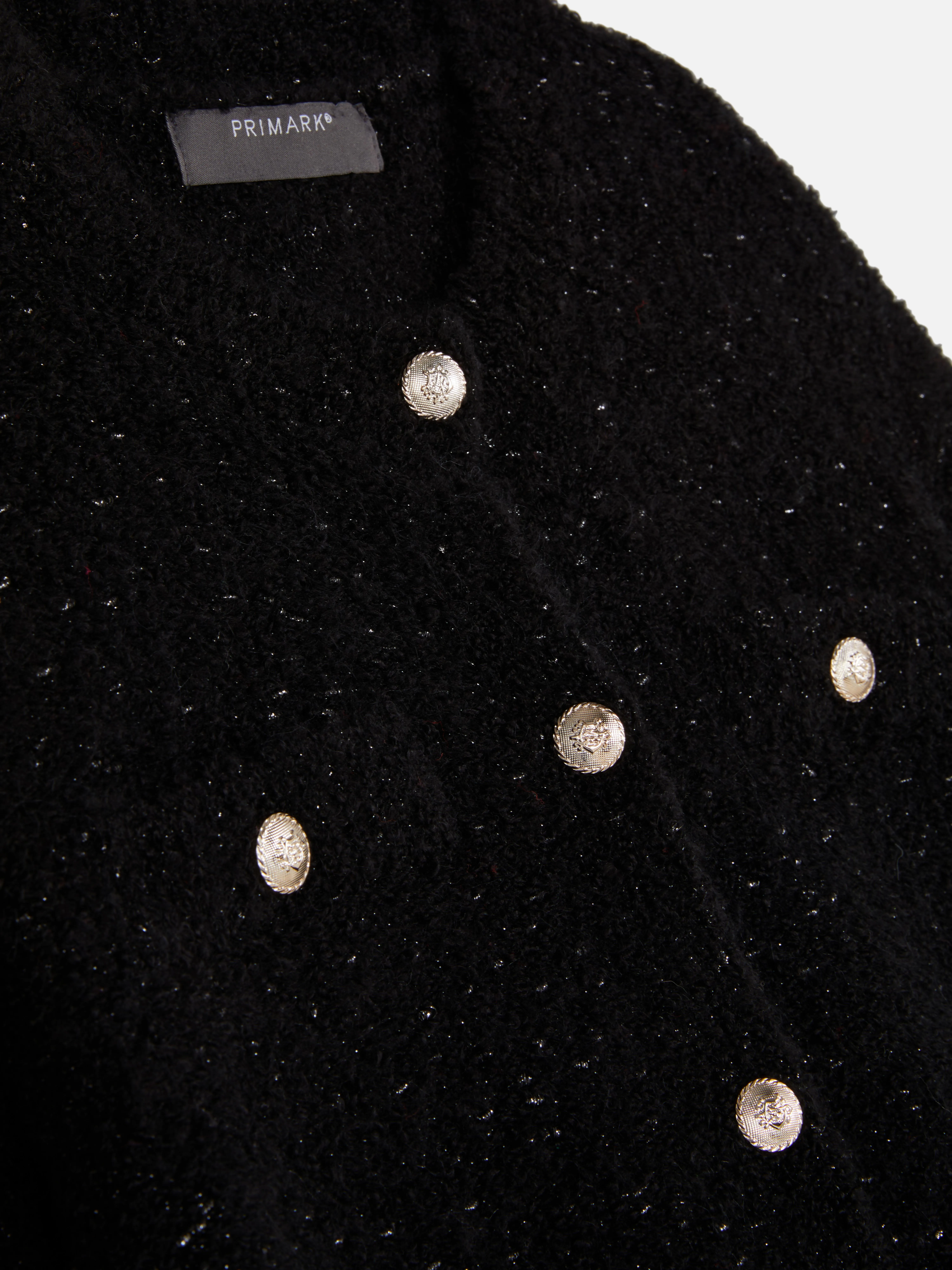Cardigan scintillante con bottoni