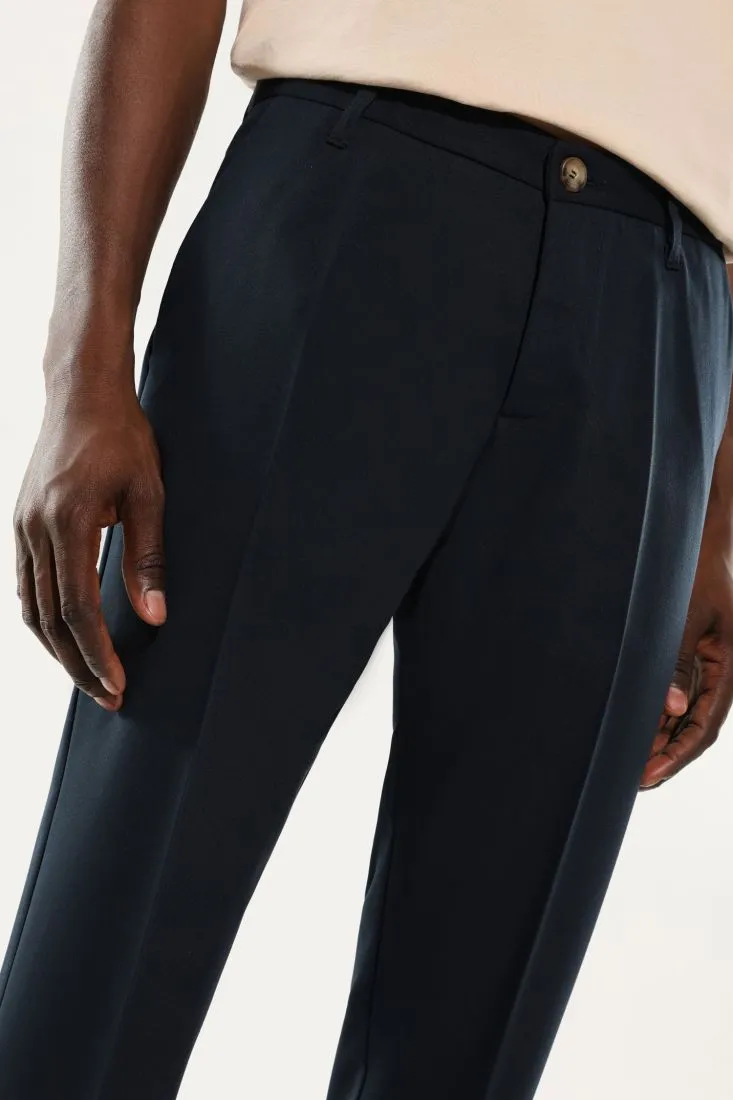 Pantaloni slim-fit monocolour con piega stirata